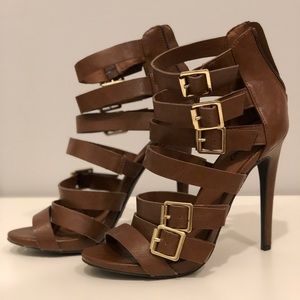 Tan strappy stilettos with gold buckle details